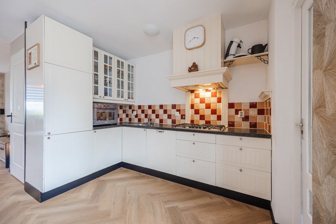 Tussenwoning te koop: Kastanjelaan 28, Halsteren