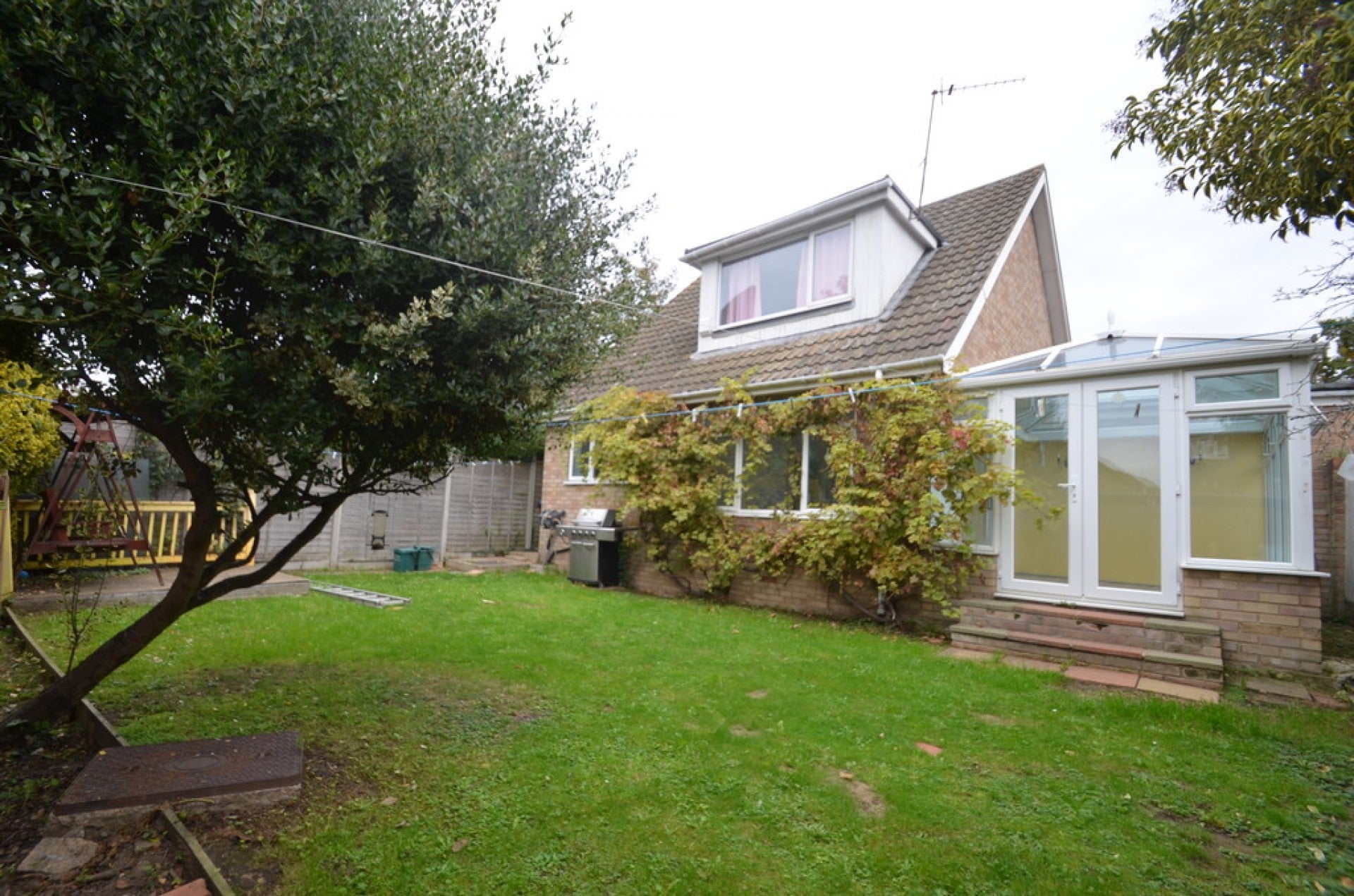 House New Road in Borough of Runnymede