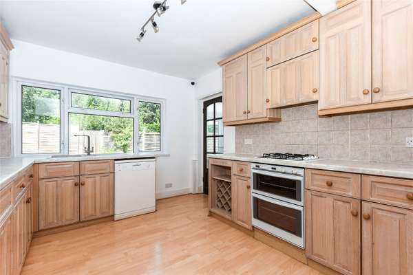 House Sandhills Lane in Borough of Runnymede