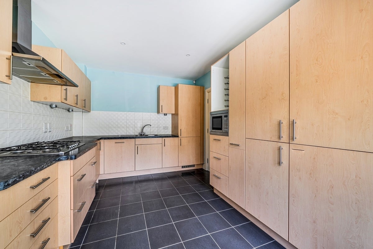 House Nower Close East in Mole Valley