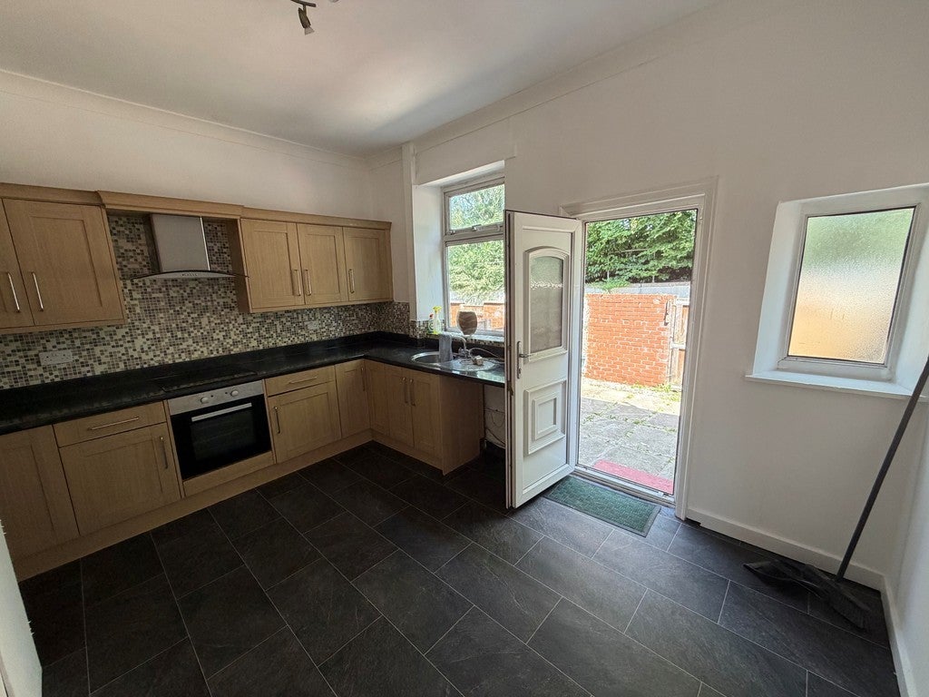 House Back Ivanhoe Street in Farnworth