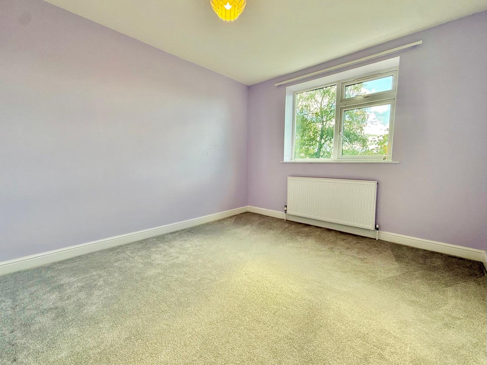 Flat Emmott Drive in Leeds
