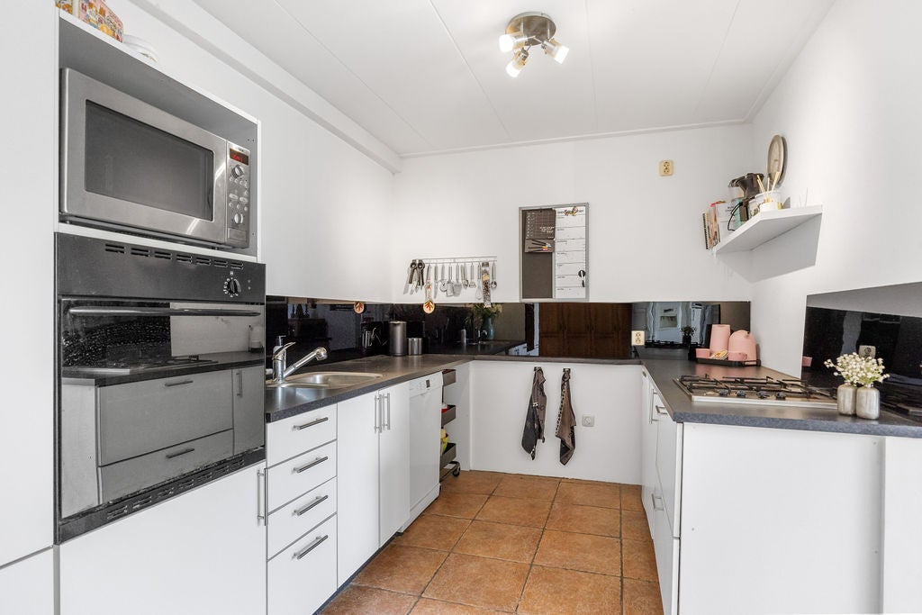Tussenwoning te koop: Geeuwkade 48, Sneek