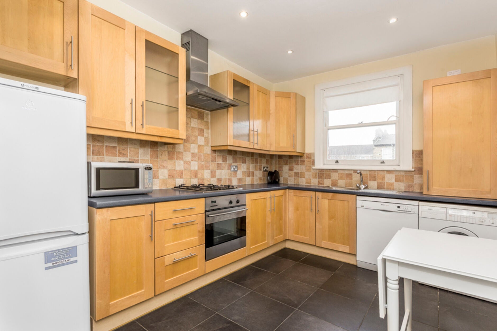 Flat Ellingham Road in Greater London