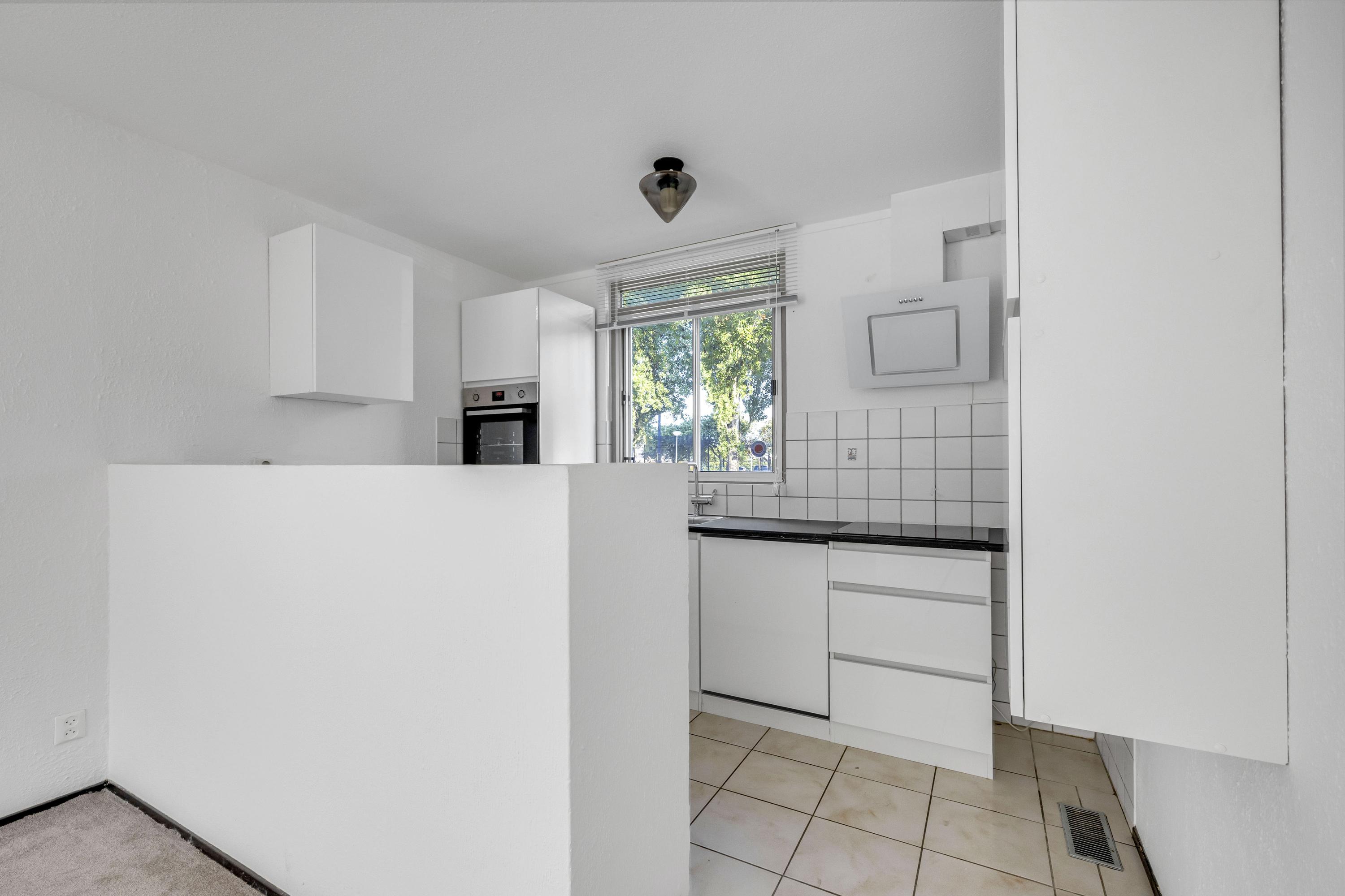 Tussenwoning te koop: Harkje Benthempad 31, Schiedam