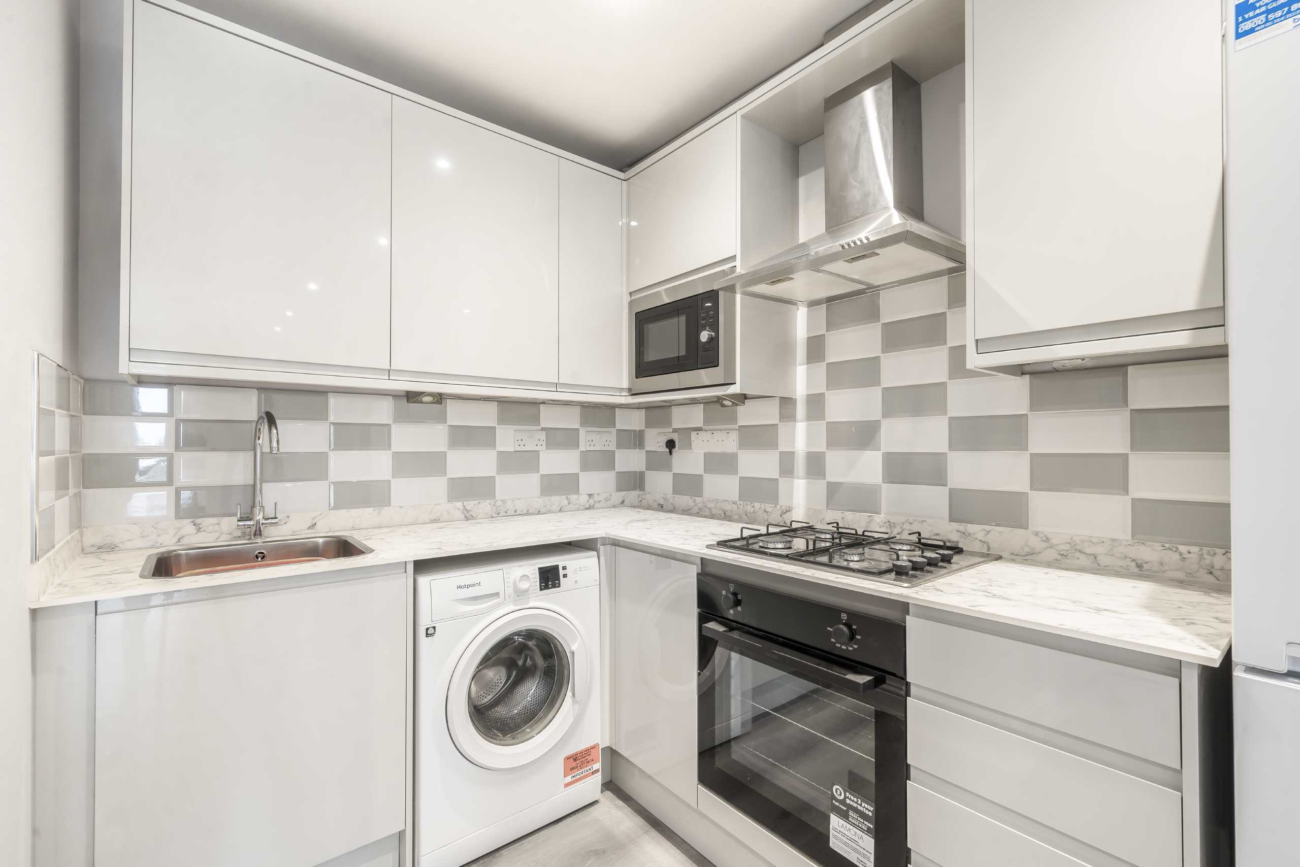 Flat Haydon Park Road in Greater London