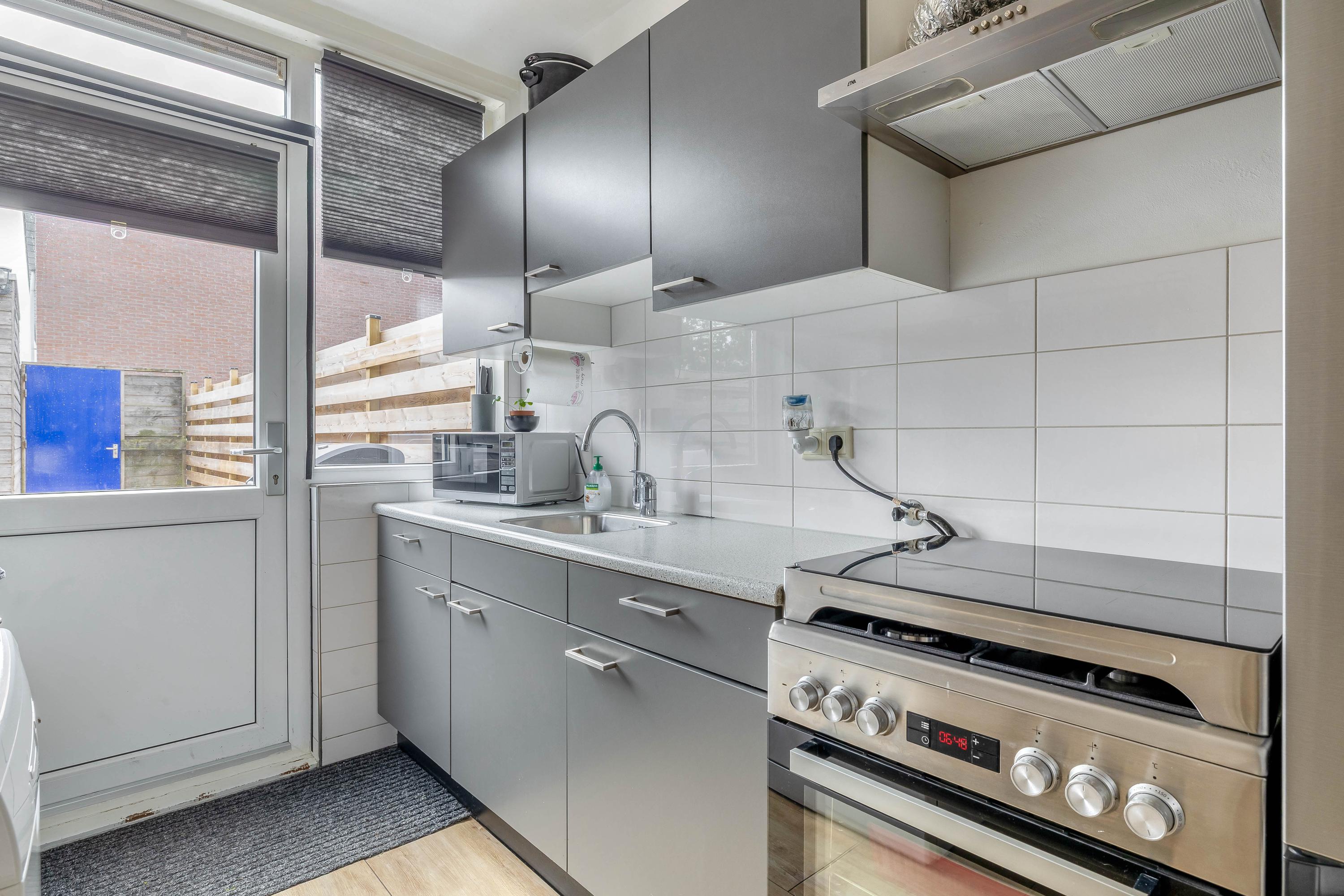 Tussenwoning te koop: Hugo de Grootstraat 142, Oude Pekela